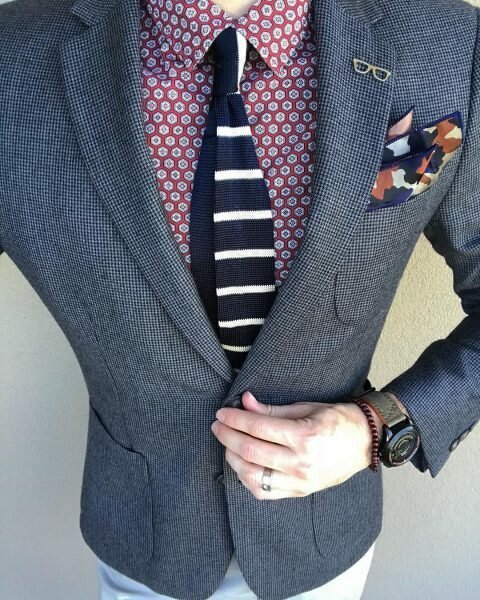 Man with too many accessories and lapel pins via Instagram