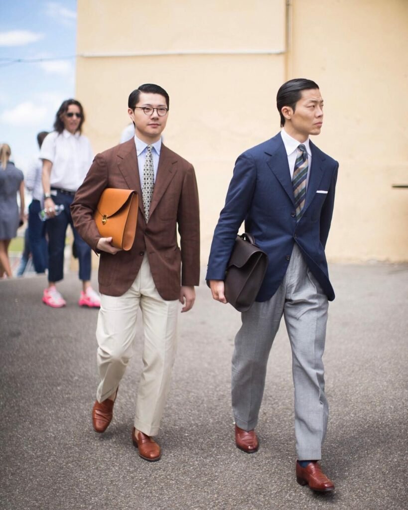 Joe Ha (right) and bespoke tailor Zing Chen (left) at Pitti Uomo 94 in conservative classic menswear | Photo via. The Finery Company
