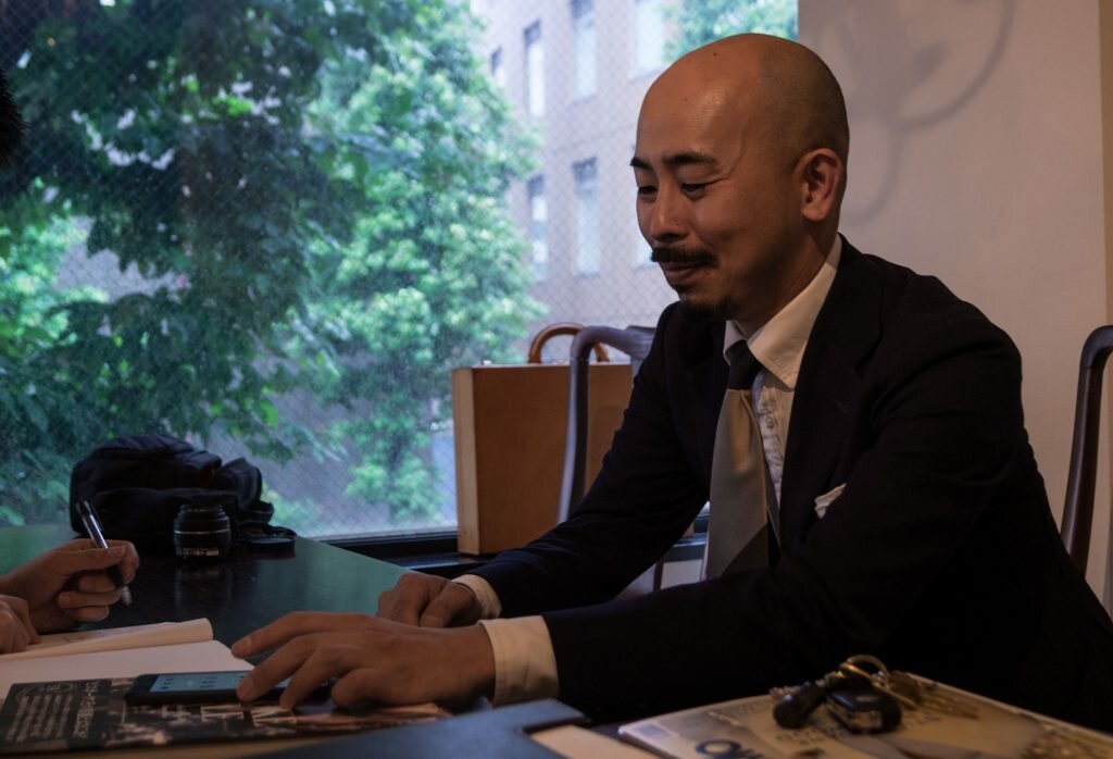 Yohei Fukuda demonstrates his shoe consultation process