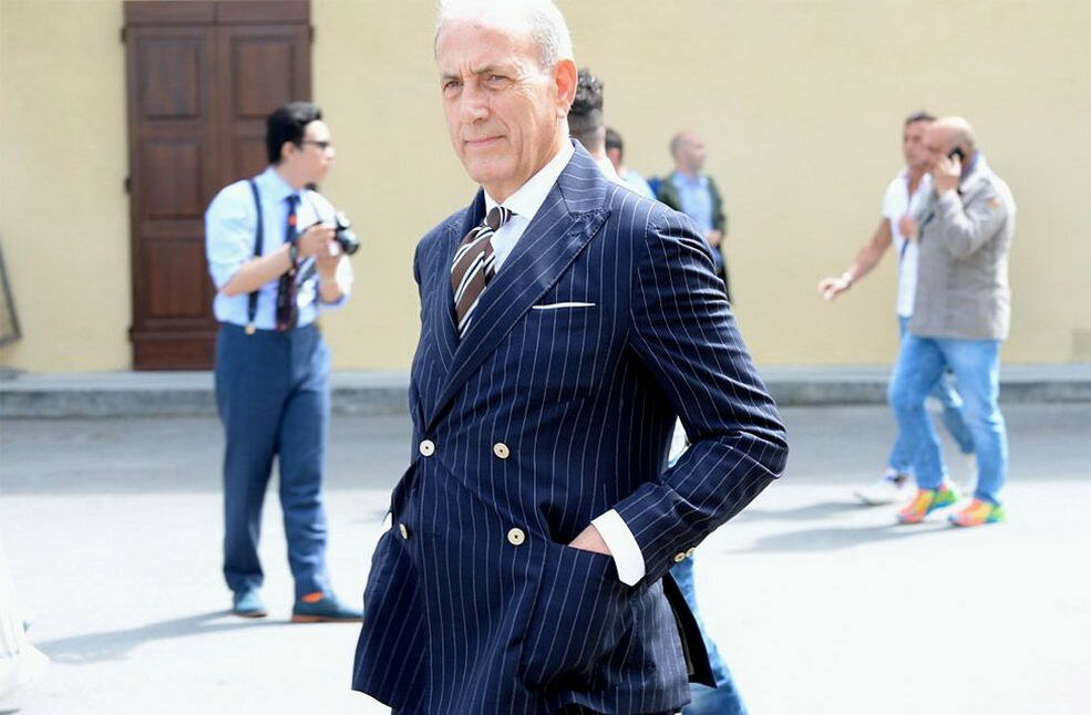 Seasoned-Gentleman-in-navy-striped-suit-with-triple-stripe-tie