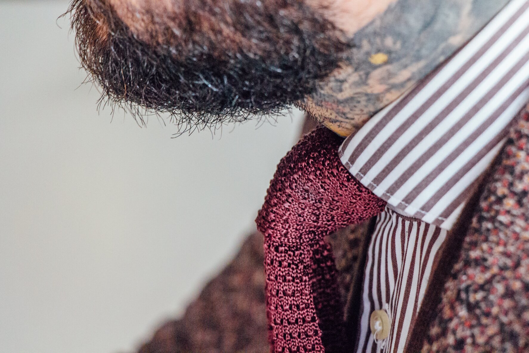 Knit tie with a beard to match.